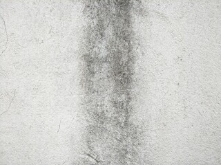 Background of old concrete wall with faint straight line stain at the central image.