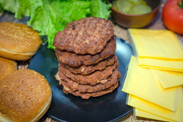 fried beef patty and ready-made burger ingredients