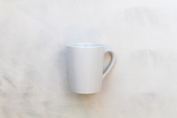 Obraz na płótnie Canvas White mug mockup on gray watercolor background flat lay copy space