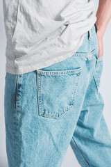 Back pocket of blue jeans. Man s hand in the back pocket of jeans. Copy, empty space for text