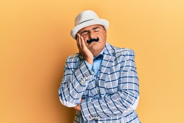 Mature middle east man with mustache wearing vintage and elegant fashion style thinking looking tired and bored with depression problems with crossed arms.