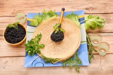 Pancakes with black caviar