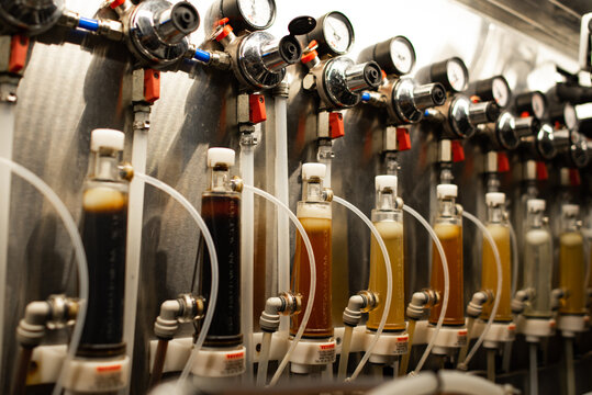 Private brewery manufacture of craft beer. Equipment for the preparation of beer. Cold room of pub bar and cafe. Selective focus.