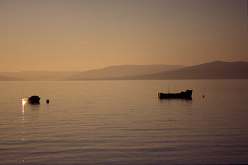 Two small boats moored off Largs on a September evening, scotland, UK, United Kingdom