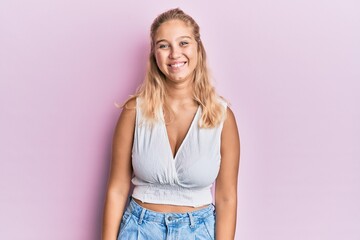 Obraz premium Young blonde girl wearing casual clothes with a happy and cool smile on face. lucky person.