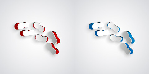 Paper cut Human footprints shoes icon isolated on grey background. Shoes sole. Paper art style. Vector