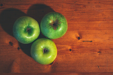 Apples on the wooden table