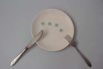 spoon and fork on white plate