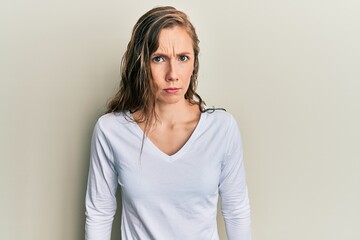 Young blonde woman wearing casual clothes skeptic and nervous, frowning upset because of problem....