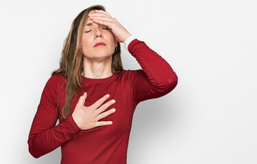 Young blonde woman wearing casual clothes touching forehead for illness and fever, flu and cold, virus sick