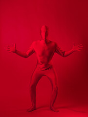 crazy red man on a red background. figure in a leotard covering the whole body