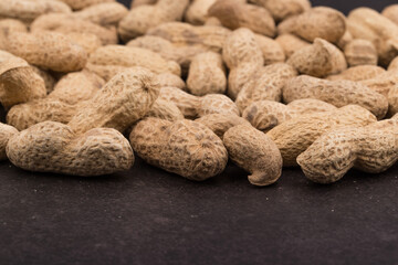Dried peanuts with shells. Close up image.