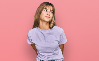 Obraz premium Teenager caucasian girl wearing casual clothes smiling looking to the side and staring away thinking.