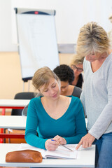 happy learner listening to teacher at lesson