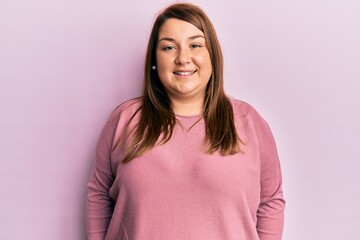 Obraz premium Beautiful brunette plus size woman wearing casual winter sweater with a happy and cool smile on face. lucky person.