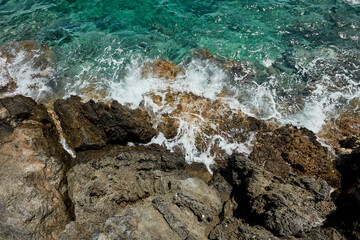 Blue sea water on the shores of the Aegean Sea on a sunny day