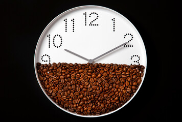 white wall clock and fresh roasted coffee beans on black background