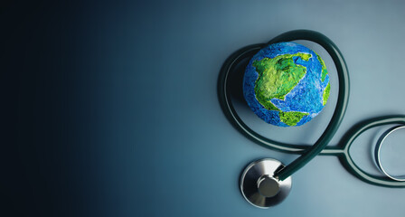 World Health Day. Global Health Awareness Concept. Handmade Globe inside Stethoscope as Heart...