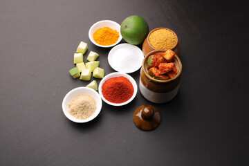 Homemade Mango Pickle or aam ka achar Kairi Loncha with Ingredients.