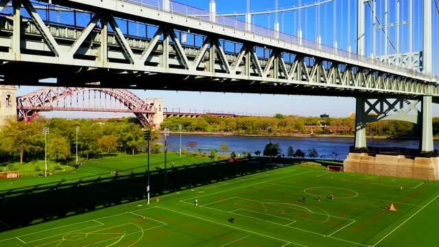 Aerial Crane Shot of the RFK and the Hell Gate Bridge Over the East River