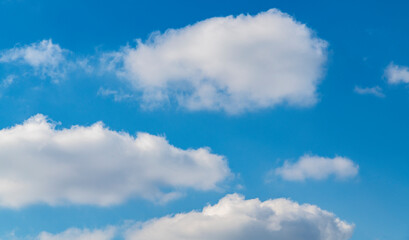 Beautiful blue sky with fluffy white clouds. Sky clouds backgrounds.