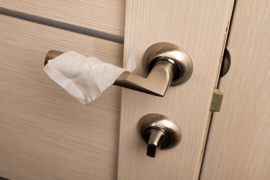 clean the doorknob with an antiseptic cleaning cloth