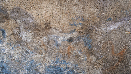 Textured wall in cream, yellow and blue tones.