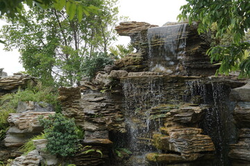 Beautiful artificial waterfall of garden in Thailand