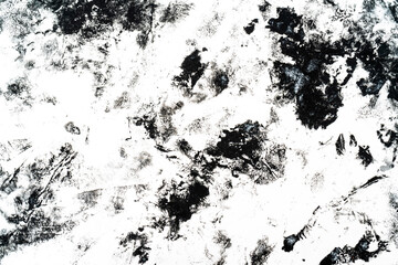 Black blots and spots on a white background.