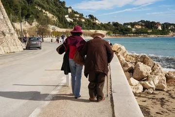 Printed roller blinds Villefranche-sur-Mer, French Riviera An elderly couple strolls along the promenade along the Mediterranean coast on a sunny spring day. South coast of France, Villefranche-sur-Mer.