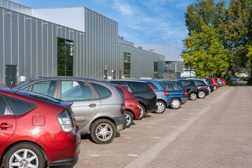 Facade business establishment with row of parked cars