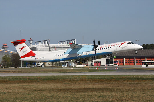 FRANKFURT AM MAIN, GERMANY - APRIL 2, 2011: Tyrolean Airways Bombardier Dash 8 Q400 with registration OE-LGD in Austrian arrows livery just airborne at Frankfurt Airport.