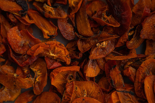 Dried persimmon in the form of an abstract background