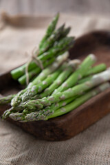 Delicious asparagus on a wooden background