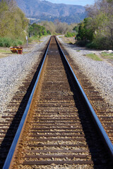 Fototapeta na wymiar Southern California railroad tracks of a line along the coast near the town of Carpinteria