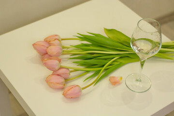 Glass of wine and tulips