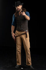 Cowboy with guns. Studio shooting