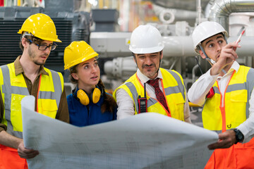 Industry engineering team having discussion work plan in the factory	