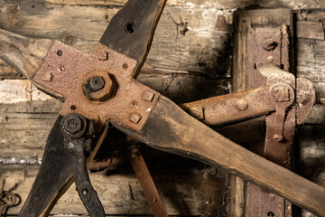 scrap metal parts and old rusty tools in abandoned workshop