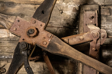 scrap metal parts and old rusty tools in abandoned workshop