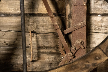 scrap metal parts and old rusty tools in abandoned workshop
