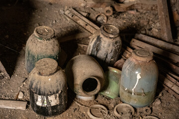 scrap metal parts and old rusty tools in abandoned workshop