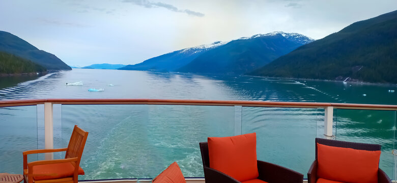 inside passage in Alaska for ship. view of mountain and ocean from a cruise ships open bar