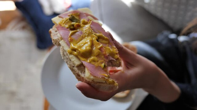 Homemade open sandwich on sourdough bread with ham, cheddar cheese and piccalilli