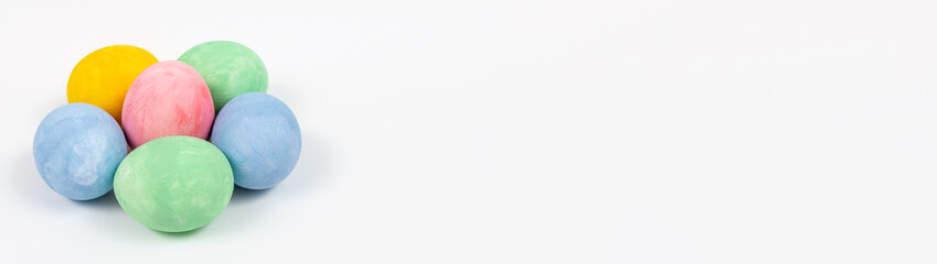 Colorful Easter flower shaped eggs on a light background. Painted decorated eggs, selective focus. Banner