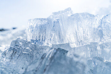 Naklejka na ściany i meble Stacks of drift ice piled up against the dutch coast with crystal clear sunlight