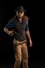 Cowboy with guns. Studio shooting