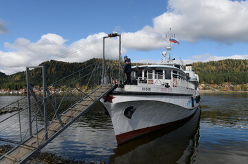 The passenger ship "Pioneer of Altai" is moored at the shore of Lake Teletskoye in the village of Iogach. Altai Republic © b201735