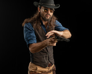 Cowboy with guns. Studio shooting