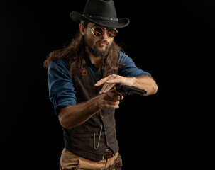 Cowboy with guns. Studio shooting